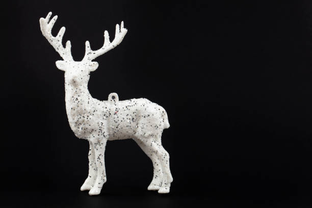 istock Festive dark Christmas background. White deer on a black background. 1478368294