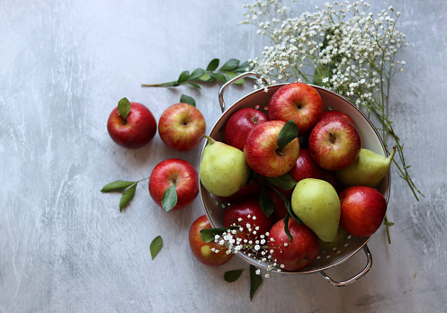 Still life with beautiful red apples on a table. Juicy summer fruit close up photo. Eating fresh concept.