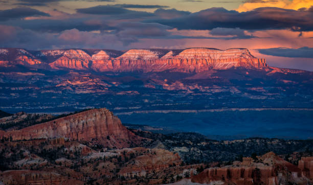 Bryce Canyon National Park, Utah. USA. Last light off sunset on the Sinking Ship & Aquarius Plateau. View from Sunrise Point.