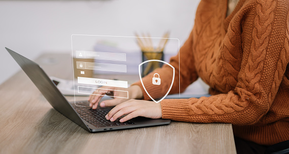 woman typing login and password in the concept of cyber security, information security, data protection, and encryption for secure access to user's personal information.