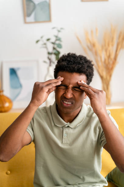 istock Cheerful black man covering eyes, headache 1478374310