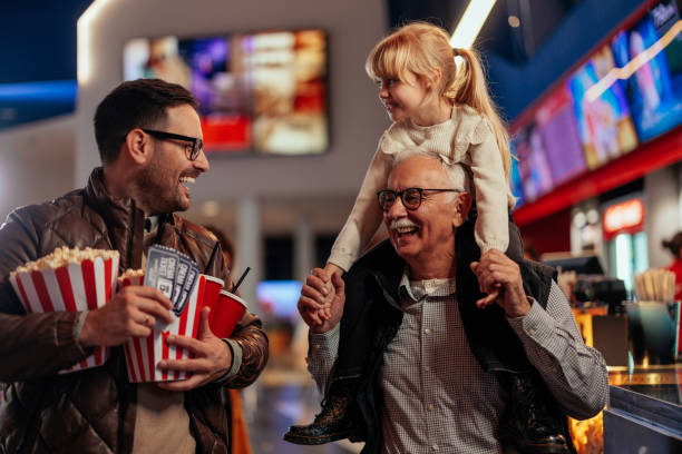 istock Joyful multigenerational family in cinema. 1478374541