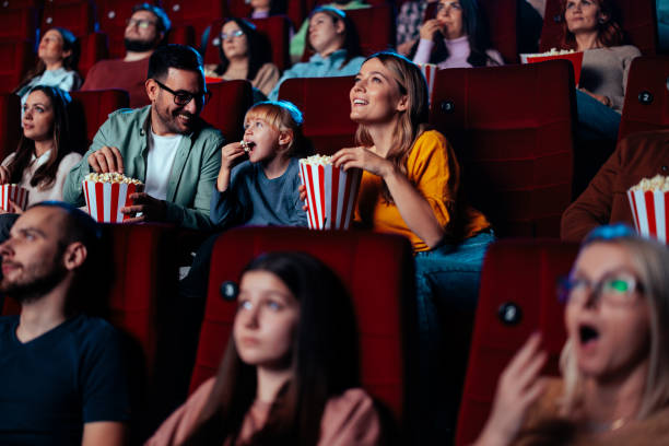 istock Parents with child in cinema. 1478374857