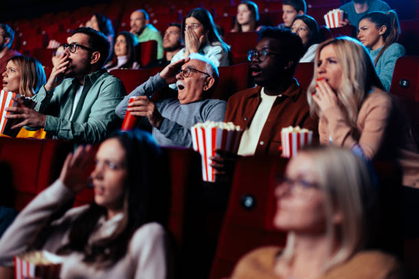 istock Scared audience in movie theater. 1478374868