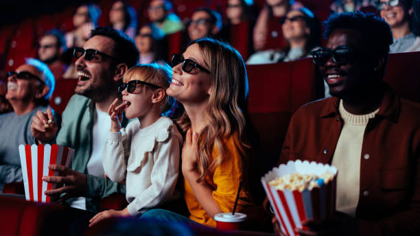 istock People watching 3D movie in theater. 1478374883