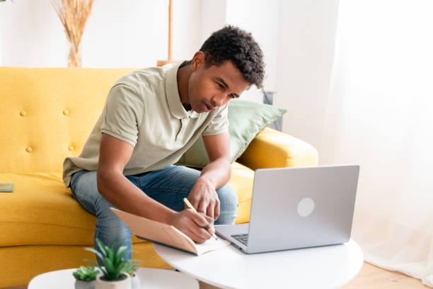istock African American man working on laptop 1478375020