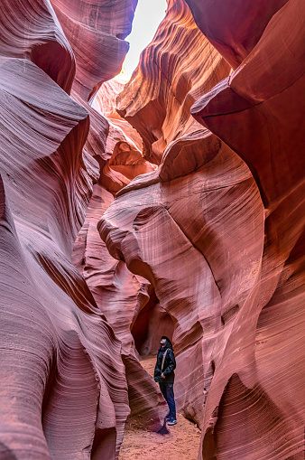 Red sandstone texture of the lower antelope canyon with perfect light from above.