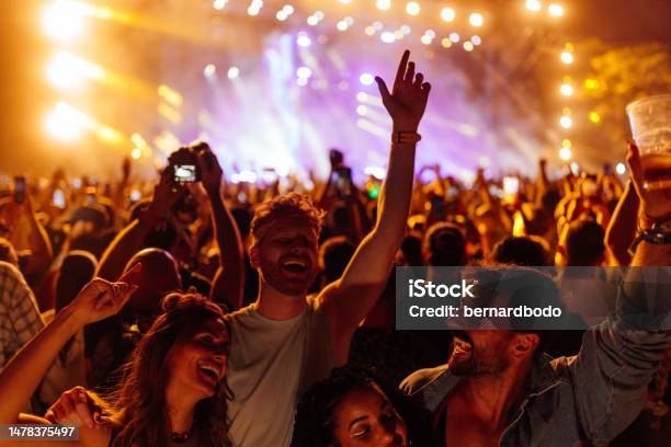 Friends Dancing At The Festival Stock Photo - Download Image Now - Music Festival, Friendship, Music