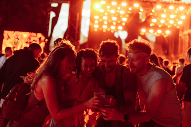 istock Friends toasting with beer at concert 1478375546