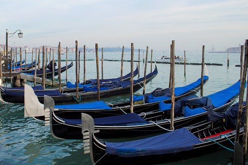 Gondolas traditional boats in Venice on the promenade of the Grand Canal for the entertainment of tourists