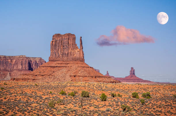 West Mitten Butte with the moon at Monument Valley West Mitten Butte with the moon at dawn in Monument Valley tribal park, Arizona, USA west mitten stock pictures, royalty-free photos & images