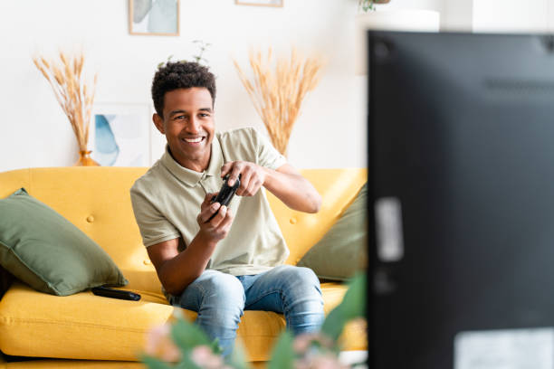 istock Cheerful black man playing videogames 1478380013