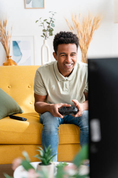 istock Cheerful black man playing videogames 1478380158