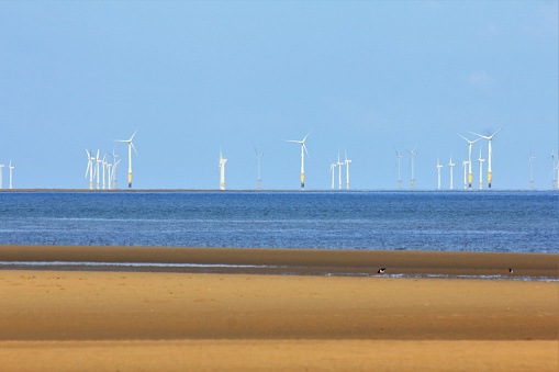 Wind farm of the coast of North Wales on a sunny day