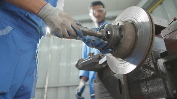 istock Team industrial engineers or technicians installing and adjusting machines for operating to produce spare parts after maintenance. Multiracial worker are working n production line to produce as-desired metal parts at metal manufacturing. 1478380490