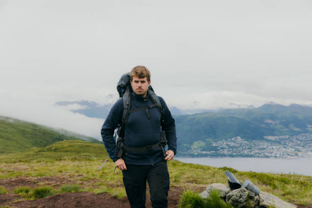 istock Man with backpack hiking in summer mountains of Norway 1478382343