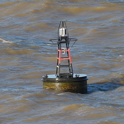 A navigation bouy, marking the deep channel for large vessels, in the busy River Plate, on the Uruguay-Argentina border