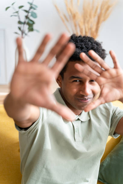 istock Smiling ethnic boy showing stop gesture 1478386591