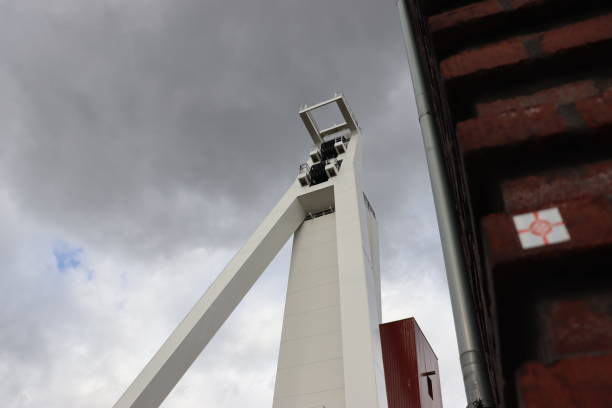 istock Low angle view of a tall abstract modern building under the cloudy sky 1478386885