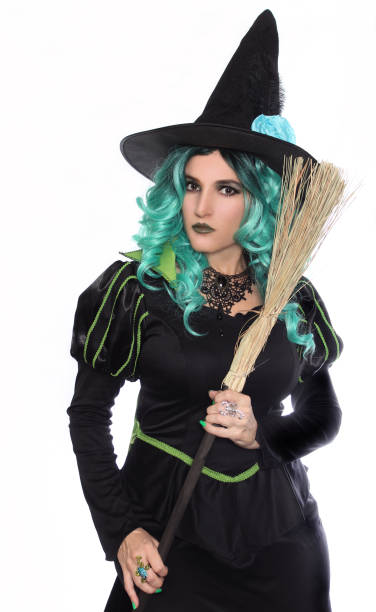 istock Photo of a witch with broom on a white background 1478388628