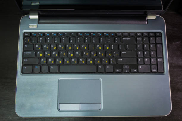 istock Laptop keyboard with letters in Hebrew and English 1478391443