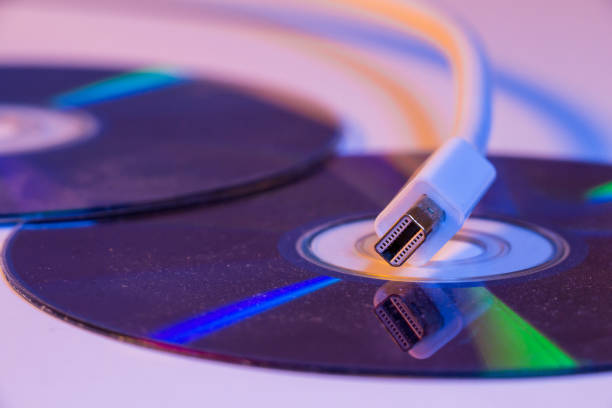 istock Closeup of white Mini Display port cable with it's reflection on a blank disc 1478392627