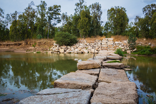 A beautiful view of stones in the water at Nahal Soreq, Israel