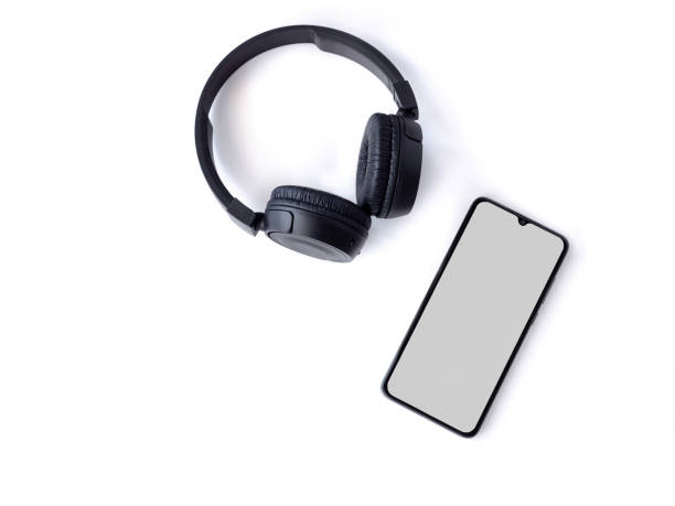 A black wireless headphone and mobile phone with a blank screen mockup on a white background