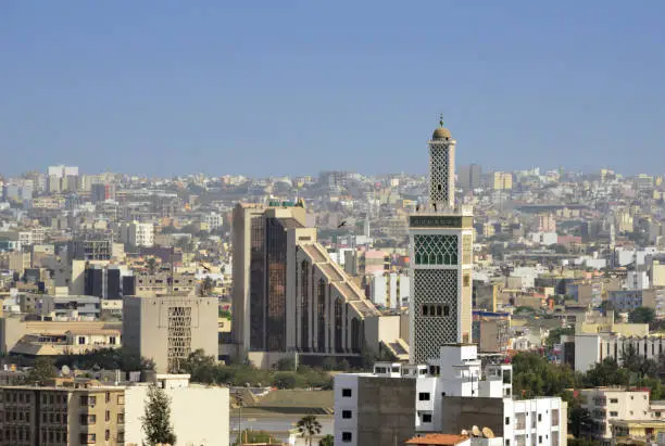 Dakar (Plateau), Senegal: urban skyline with the BCEAO-Senegal building and the Moorish minaret of the Grand Mosque of Dakar.