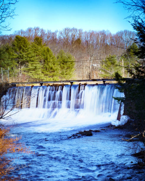 istock Beautiful view of a waterfall surrounded by trees 1478393561