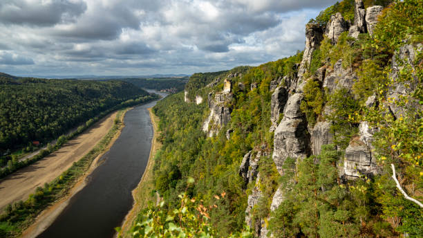 Bird's eye view of a stream flwoing through the Elbe Sandstone mountains on a gloomy day A bird's eye view of a stream flwoing through the Elbe Sandstone mountains on a gloomy day elbe river stock pictures, royalty-free photos & images