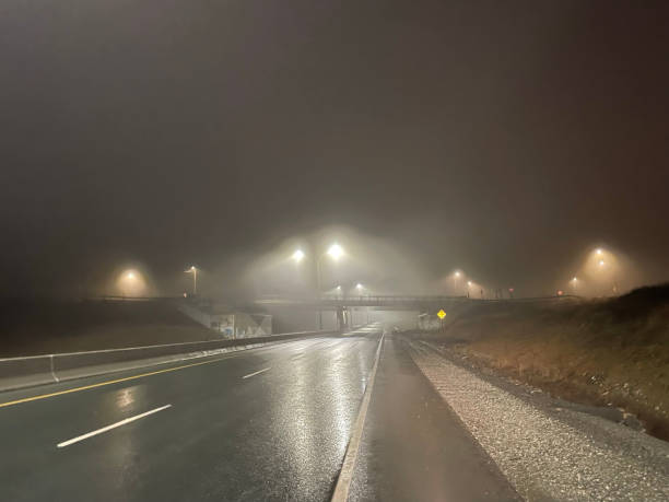 istock Foggy night on the highway 1478395267