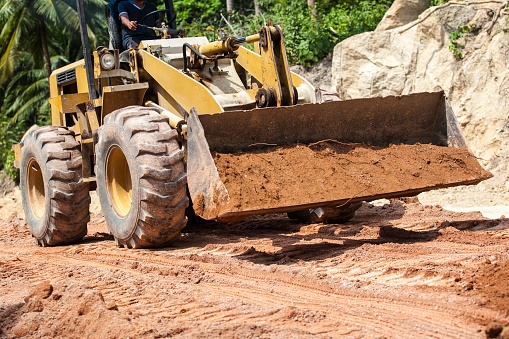 front-loader moving earth on a construction site
