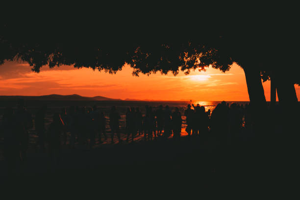 istock Group of people watching sunset 1478395986