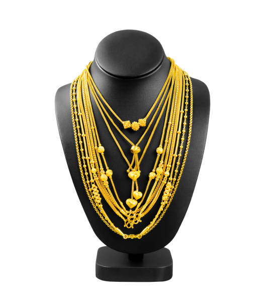 istock The Gold necklace on necklace display stand isolated on white background, Save Clipping path. 1478397708