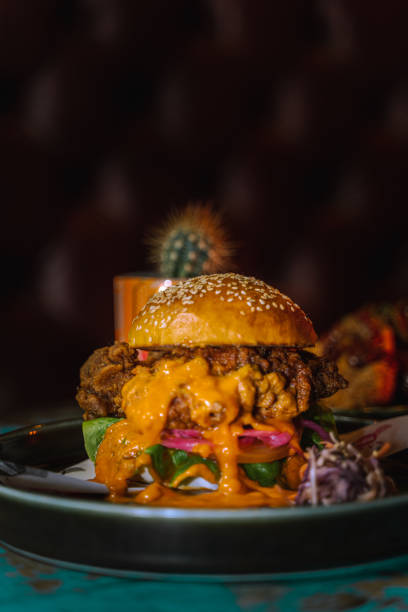 istock Vertical shot of a delicious burger with sauce 1478397928
