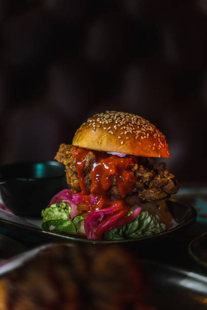 istock Vertical shot of a delicious burger with sauce 1478397933