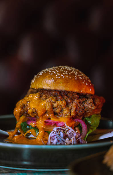 istock Vertical shot of a delicious burger with sauce 1478397935