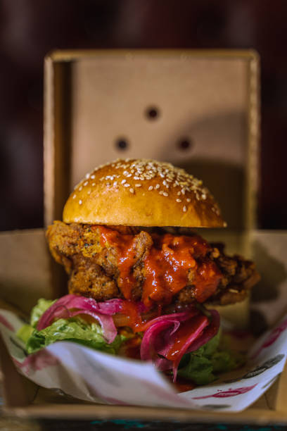 istock Vertical shot of a delicious burger with sauce 1478397942