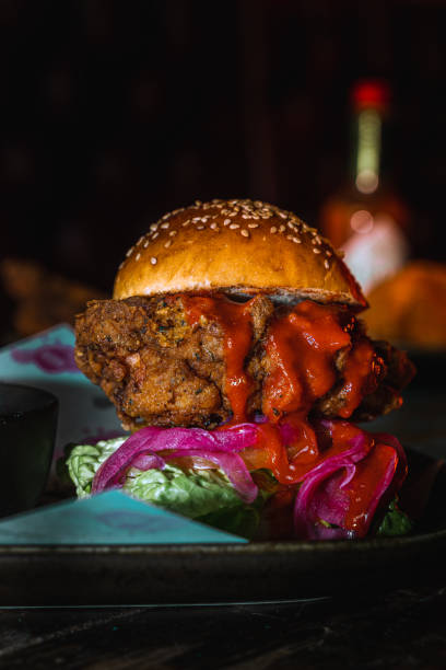 istock Vertical shot of a delicious burger with sauce 1478397982
