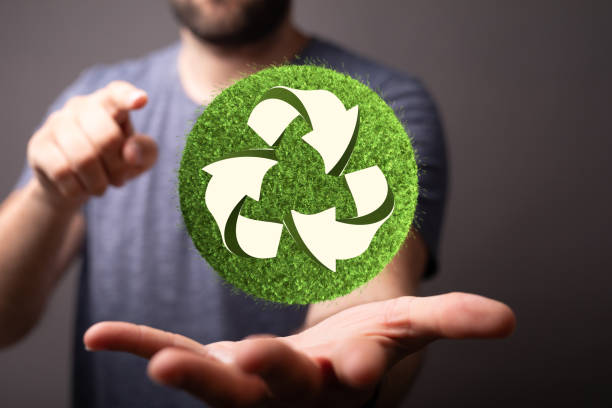 istock Caucasian man hand holding green recycle sign, three arrows 3D 1478399044