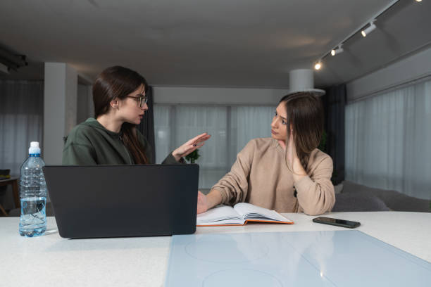 istock Two Happy Ladies Using Laptop Computer Working And Learning Online Together Or Making Video Call Sitting At Desk In Modern Home Office. E-Learning. Females Entrepreneurship Career Concept 1478399883