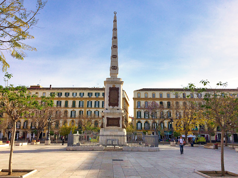 Malaga, Spain – April 15, 2016: Malaga, Spain, April 2016: Obelisk at the plaza de la Merced in which is in honour of General Torrijos.