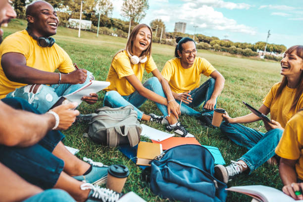 istock College students studying together in university campus - Multiracial friends having fun hanging out at the park - Life style concept with millenial guys and girls enjoying time together 1478403351