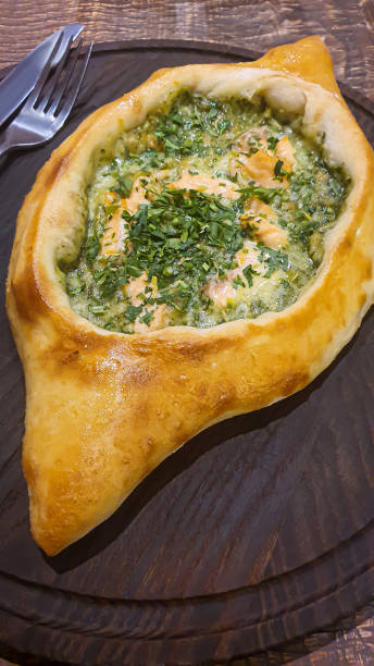 istock Georgian pastry dish. Pie with red fish and spinach. 1478403543