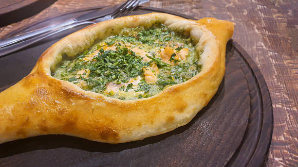 istock Georgian pastry dish. Pie with red fish and spinach. 1478403545