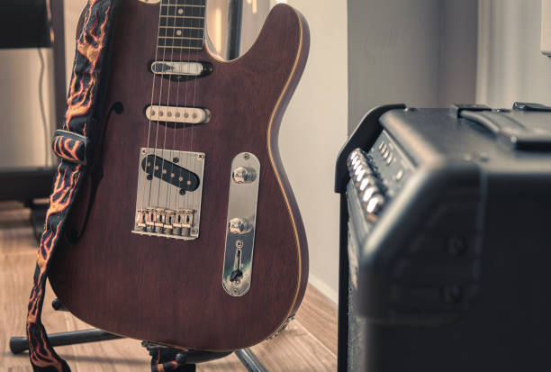 istock Electric guitar and black amplifier. Guitar practice at home 1478403666