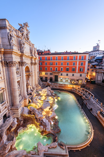 Rome, Italy overlooking Trevi Fountain during twilight.