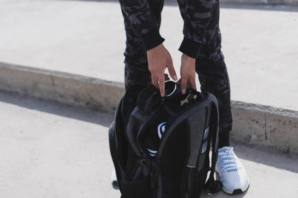 istock Closeup shot of a male looking through a backpack with exercise equipment 1478408752