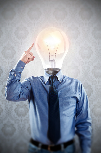 In Photoshop, a light bulb has been replaced with a man's head for conceptual image of coming up with an idea.